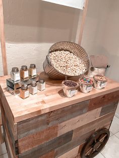 a wooden table topped with lots of food