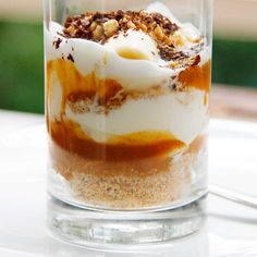 a dessert in a glass on top of a table