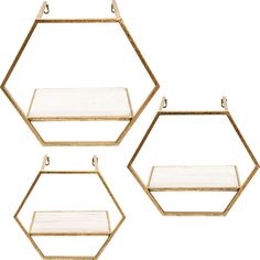 three gold hexagonal shelves with glass shelves