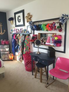 a room filled with lots of colorful items and accessories on the wall above a desk