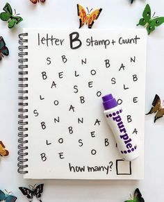 a notebook with a marker and butterflies surrounding it that says, letter b stamp - count