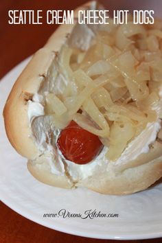 a hot dog with onions and ketchup on a plate