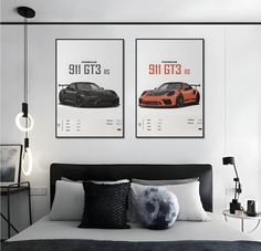 a bedroom with two posters above the bed