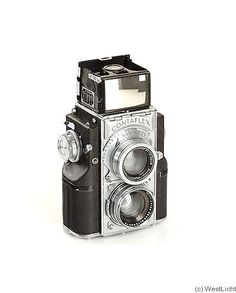 an old fashioned camera on a white background