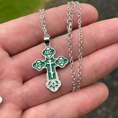 Orthodox crosses with a chain necklace and comes in many beautiful colors - red, white, black, green, and blue Gold plated crosses come with 22” chain Silver plated crosses come with 20” chain Reverse side says “Save & Protect” (Спаси и сохрани) Made from zinc alloy Dimensions: 1” x 1.4” inches Fast shipping from the U.S. Gift Crucifix Cross Necklace With Chain, Gift Cross Necklace With Crucifix Chain, Green Cross Necklace For Gift, Orthodox Cross Necklace, Rope Cross, Orthodox Cross, Chain Silver, Green And Blue, White Silver