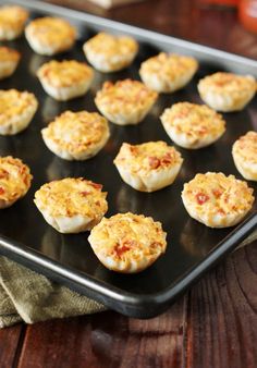 there are many small food items on the baking sheet, ready to be baked in the oven