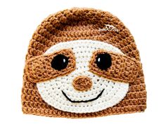 a crocheted hat with a smiling slot face