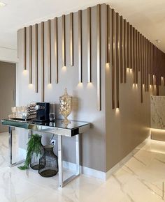 a modern living room with white marble flooring and wood paneling on the wall