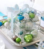 a glass container filled with ornaments on top of a table