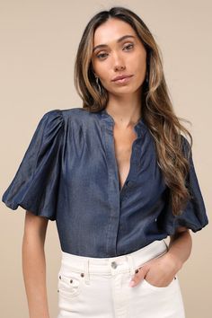 Bring a chic vibe to your everyday looks with the Lulus Contemporary Crush Dark Blue Chambray Puff Sleeve Button-Up Top! Lightweight woven chambray fabric shapes this stylish top that has pleated-like detailing at the shoulders and short puff sleeves with elastic at the cuffs. Crew neckline tops a functional, hidden button placket that runs down the bodice to rounded hems. Fit: This garment fits true to size. Length: Size medium measures 25" from shoulder to hem. Bust: Great for any cup size. Wa Summer Puff Sleeve Denim Top, Chic Button-up Denim Top For Fall, Chic Fall Button-up Denim Top, Denim Blue Button-up Workwear Blouse, Chic Cotton Puff Sleeve Top For Day Out, Blue Puff Sleeve Top For Workwear, Blue Puff Sleeve Top For Work, Chambray Denim Top For Workwear, Blue Denim Top For Summer Workwear