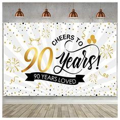 a white and gold party banner with the words cheers to 90 years 50 years loved