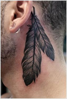 a man with a tattoo on his neck has a black feather behind the ear that says 40 amazing feather tattoos you need to see on your body