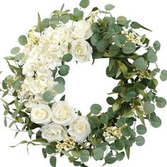 a wreath with white flowers and green leaves