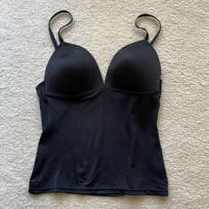 Nwot, Never Worn, Fits C Cup Size Black Sleeveless Tank Top With Removable Bra Pads, Black Sleeveless Tops With Removable Bra Pads, Black Stretch Camisole With Removable Bra Pads, Camisole Bra With Medium Bust Support, Black Cami Top With Removable Bra Pads, Black Bra Friendly Tank Camisole, Lined Body Camisole, Solid Color Camisole With Lined Body, Sleeveless Shapewear With Straps