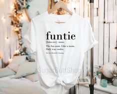 Funtie Definition Shirt, Auntie Shirts, Aunt T Shirt, Best Auntie Ever, Gift For Aunt, Aunt Birthday Shirt, Funny Aunt Tshirt, Aunt Gift Great Quality super soft Shirts **if you choose black apparel the font will be white** Fabric laundered, 4.3 oz., 50/25/25 polyester/combed ringspun cotton/rayon, 32 singles Contrast raglan sleeves and neck trim. Sideseamed. Retail fit. Unisex sizing. Designs are carefully pressed onto clothing using the highest quality vinyl with commercial grade apparel heat Fun Spring T-shirt As A Gift, Fun Spring T-shirt Perfect For Gifts, Spring Fun T-shirt, Fun Spring T-shirt, Fun White Top As Gift, Fun White Top As A Gift, Fun Tops With Funny Text For Gifts, Funny White Tops As Gifts, Fun Letter Print Shirt For Gifts