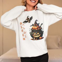 Elevate your Halloween style with our Cute Halloween Pumpkin, Witch's Cauldron Unisex Heavy Blend Crewneck Sweatshirt! This enchanting sweatshirt combines spookiness and cuteness, making it the perfect attire for any Halloween party. Whether you're conjuring up some fun at a Halloween gathering or just enjoying the festive season, this sweatshirt ensures you do it in ultimate comfort and style. 👻 **Features 👗 Adorable Halloween Pumpkin and Witch's Cauldron design 🕷️ Cozy and durable fabric pe Halloween Graphic Print Sweatshirt, Halloween Party Scary, Witchs Cauldron, Pumpkin Sweatshirt, Special Halloween, Pumpkin Sweatshirts, Spooky Designs, Spooky Pumpkin, Halloween Fashion