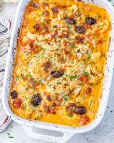 a casserole dish with cheese and meat in it