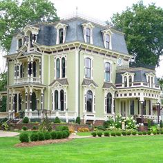 an old victorian style house with many windows