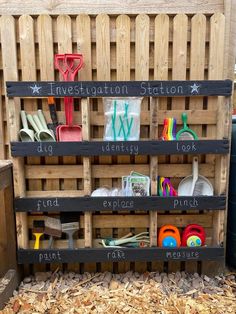 a wooden crate filled with lots of different types of utensils and other items