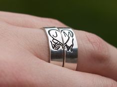 Are you in search of a matching ring set for the loved ones in your life? This design features an upside-down pinky promise with the shape of a heart made out of the bottom of the hands. The rings can include initials or be made without them, the choice is up to you! Product Details: Materials: Sterling Silver, Fine Silver, Gold Filled, or Rose Gold Filled Color: Silver, Gold, or Rose Gold Size: 6mm Two Matching Rings You will receive two hand-stamped rings filled with a black enamel finish. Personalized Couple Rings For Promise, Adjustable Stackable Rings With Initials For Wedding, Adjustable Stackable Wedding Rings With Initials, Men’s Promise Rings, Engraved Silver Couple Rings For Promise, Silver Metal Couple Rings For Promise, Adjustable Heart-shaped Couple Rings For Promise, Couples' Promise Ring Jewelry For Valentine's Day, Paragraph For Boyfriend