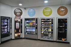 three vending machines with drinks and beverages in them