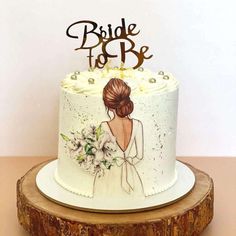 a wedding cake with the bride to be painted on it