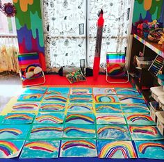 a room with many different colored papers on the floor