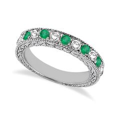 a white gold ring with emeralds and diamonds