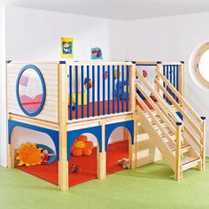 a child's room with a bunk bed, stairs and rugs on the floor