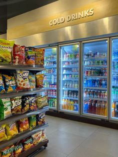 an empty grocery store with cold drinks and snacks