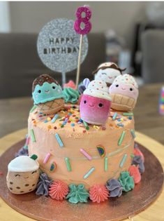 a birthday cake decorated with ice cream and sprinkles