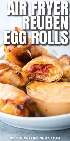 air fryer reuben egg rolls on a plate with text overlay that reads air fryer reuben egg rolls