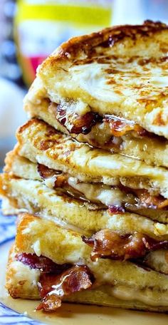 a stack of pancakes sitting on top of a blue and white plate