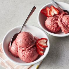 two bowls filled with ice cream and strawberries