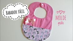 a baby bib with a pink and gray design on it, next to a thought bubble