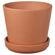 a large clay pot with two smaller pots on each side and one larger planter in the middle