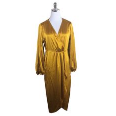 Worthington Gold Satin Wrap Look A-Line Dress Size Small V-Neck Long Full Sleeves Elastic Cuffs Elastic Waist Bust: 20" Waist: 15" Hips: 19" Length: 44.5" Sleeve: 23" 97% Polyester 3% Spandex Machine Wash New With Tags A-51/0176 Gold V-neck Midi Dress For Spring, Spring Long Sleeve Gold Midi Dress, Gold Long Sleeve Midi Dress For Spring, Gold V-neck Dress For Work, Gold Midi Dress For Spring Workwear, Spring Gold Midi Dress For Work, Gold Fitted V-neck Midi Dress, Wrap Midi Dress For Fall Party, Gold Long Sleeve Dress For Brunch