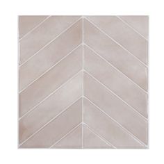 a white tile wall with an arrow pattern in the middle and one corner that has been painted beige