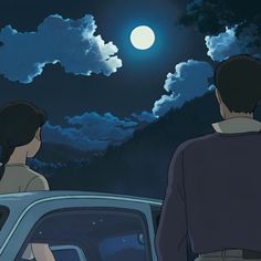 two people are looking at the moon in the night sky from an open car window