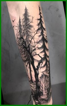 a man's leg with trees and birds on it