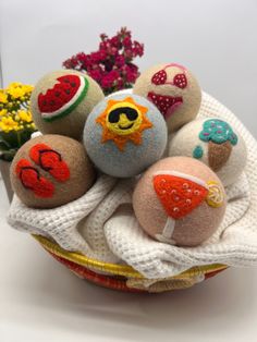 a basket filled with lots of different types of stuffed animals on top of a table