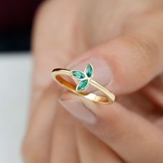 Product Details Show your girl that you want the best for her by gifting her this adorable Petal Ring on Valentines Day as a token of your love. The Promise Ring crafted in Solid Gold has three Marquise Cut Emerald Gemstones set in the petal like frame in a bezel setting. Product Information SKU SHP-RINGS0721117406 Width 2.5 mm Height 9 mm Weight 1.76 gm (Approximate) EMERALD INFORMATION No.of Stones 3 Pieces Total Weight 0.36 Carat (Approximate) Dimension(approx) Marquise-2X4 mm-3 Pcs Color Gre Emerald Promise Ring, Petal Ring, Promise Ring For Her, May Birthstone, Ring Crafts, 18k Yellow Gold Ring, The Promise, Emerald Gemstone, Vibrant Green