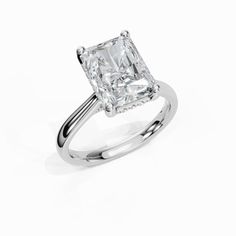 a princess cut diamond engagement ring on a white background