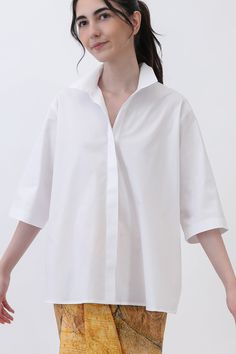 Unleash your playful side with our Camp Shirt in Italian Cotton Poplin Stretch! This shirt is not your average button-up; with its gathered back and button-up front, it's a charming twist on a classic. Plus, you can elevate your look with a chic high collar for added flair. Whether you're heading to casual spring or summer events or making it your go-to workday staple, this shirt promises versatility and style in every wear! size guide and fit New! In easy-fit sizing Designed for a comfortable, Oversized White Blouse With Placket, White Blouse With Shirttail Hem And Placket, White Collared Short Sleeve Shirt For Everyday, White Relaxed Fit Blouse With Placket, White Short Sleeve Top With Button Cuffs, White Tops With Button Cuffs And Spread Collar, White Tops With Spread Collar And Button Cuffs, White Blouse With Relaxed Fit And Placket, White Short Sleeve Button-up Shirt For Everyday