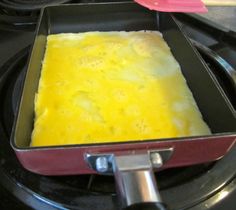 a pan filled with food sitting on top of a stove next to an electric burner