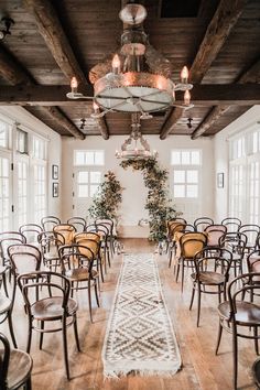 a room filled with lots of chairs and tables