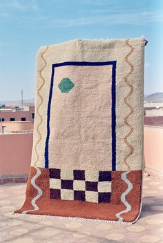 a blanket that is on top of a building