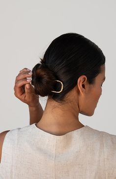 The Saintes Chignon Hair Pin by L. Erickson is a sleek and durable metal hair accessory, perfect for styling thick hair. This polished hair pin features a polished hammered finish and offers a strong hold, ensuring your hairstyle stays in place all day. Measuring 1 1/4 inches wide and 5 inches long, it is ideal for creating elegant chignons, buns, and other updos.Designed for both functionality and style, the Saintes Chignon Hair Pin adds a touch of sophistication to any look. This metal hair pi Styling Thick Hair, Bridal Workout, Metal Hair Accessories, Hair Accessories Ponytail, Chignon Hair, Polished Hair, Sleek Bun, Claw Hair Clips, Metal Hair