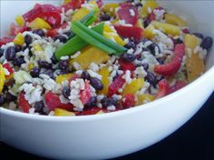 a white bowl filled with lots of food