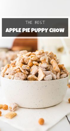 the best apple pie puppy chow recipe is in a white bowl on a counter top